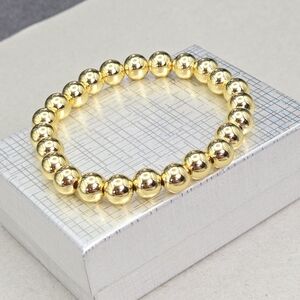 Gold Tone Stretch Bead